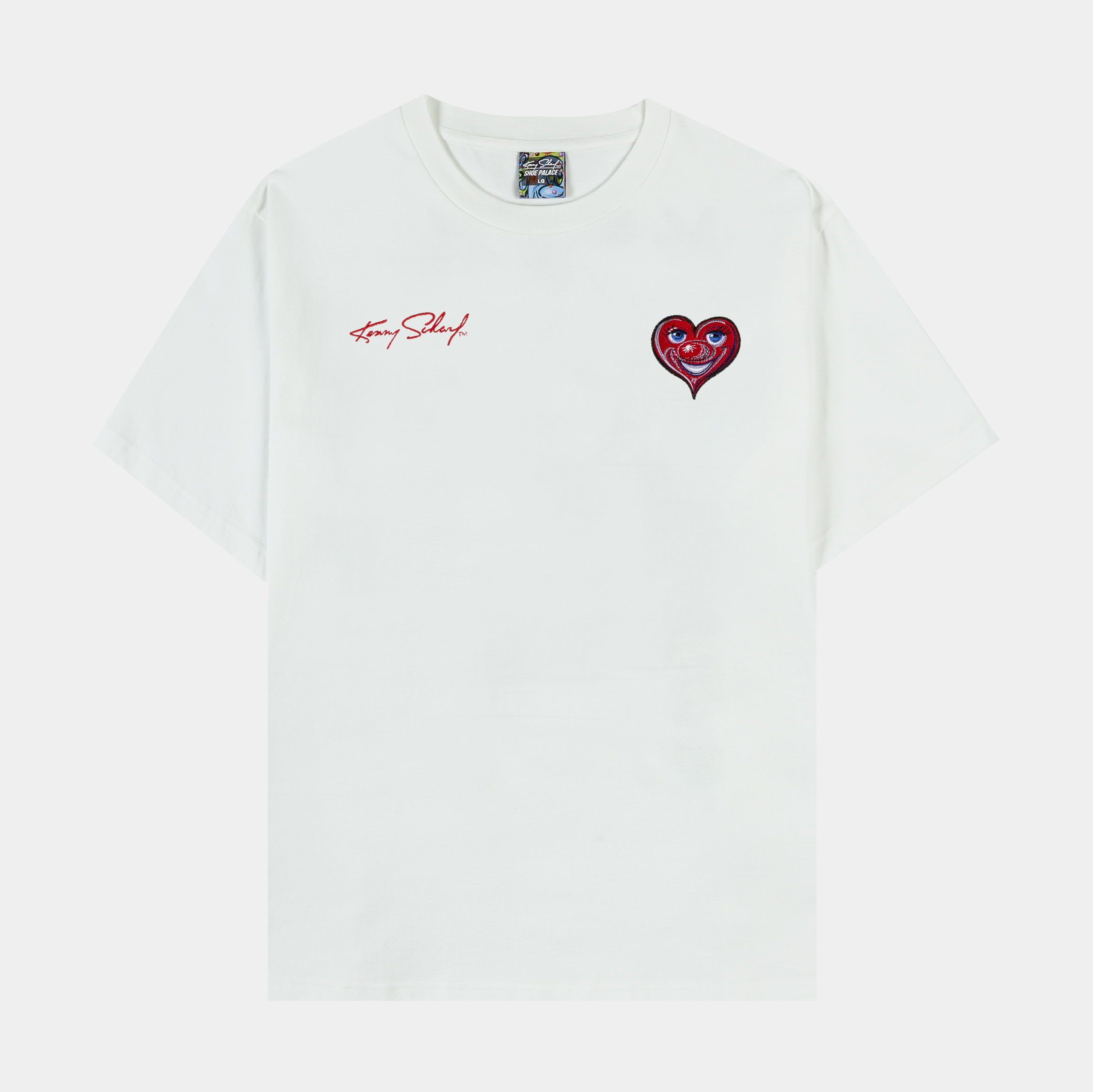 White t-shirt featuring a red heart graphic and text.