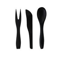 A mini black bamboo fork, knife, and spoon