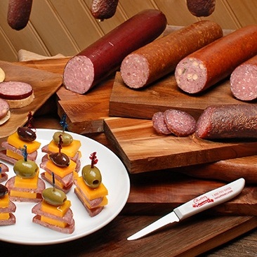 Summer sausages sliced and whole