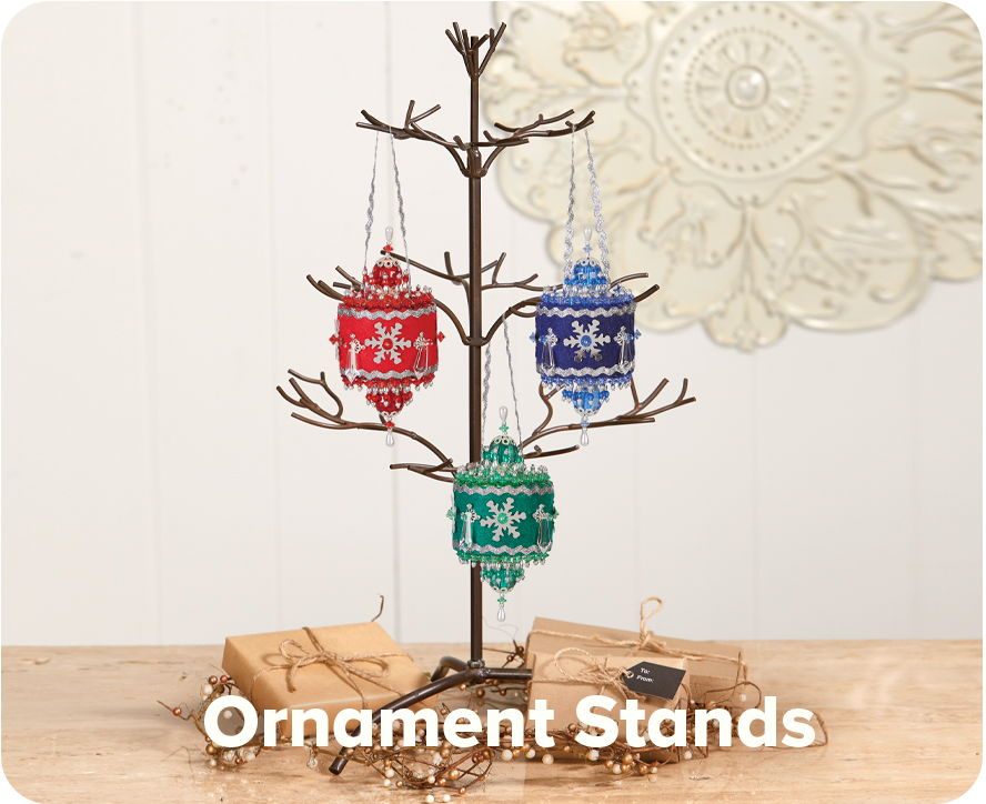 Ornament stands with colorful ornaments displayed on a branch tree.