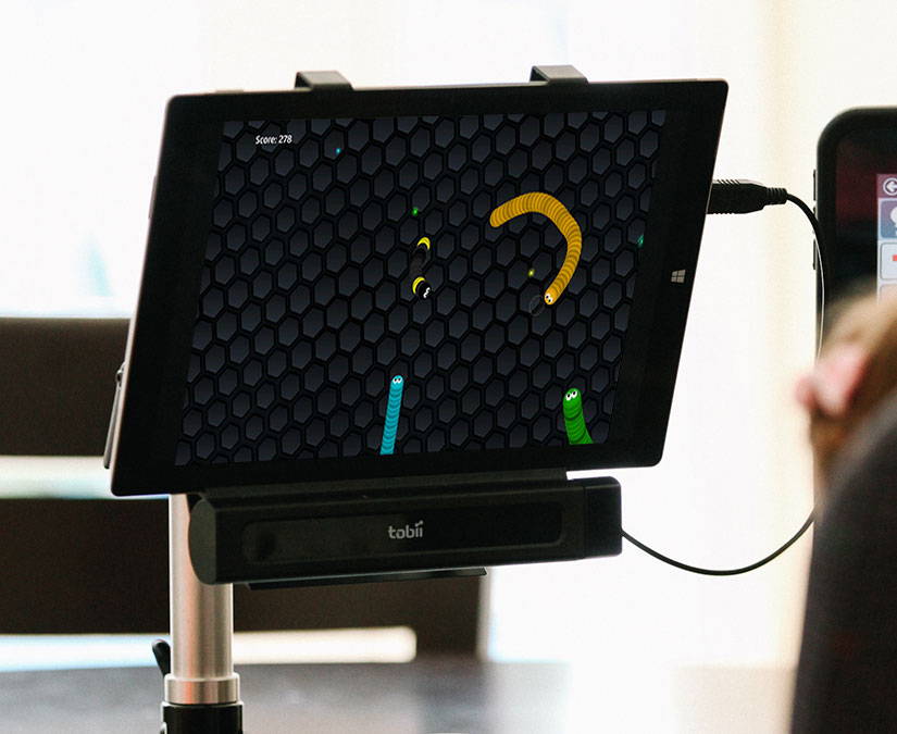 Man playing Gaze Snake with a Tobii Dynavox eye tracker