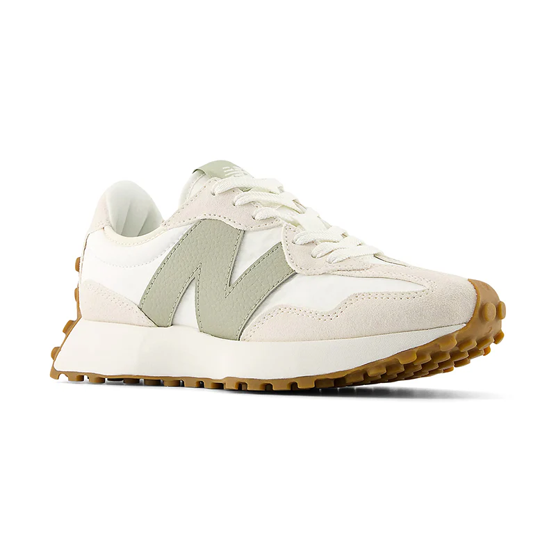 White and green New Balance sneakers with a textured sole.