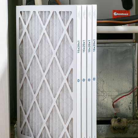 Air filters stacked in an HVAC system.