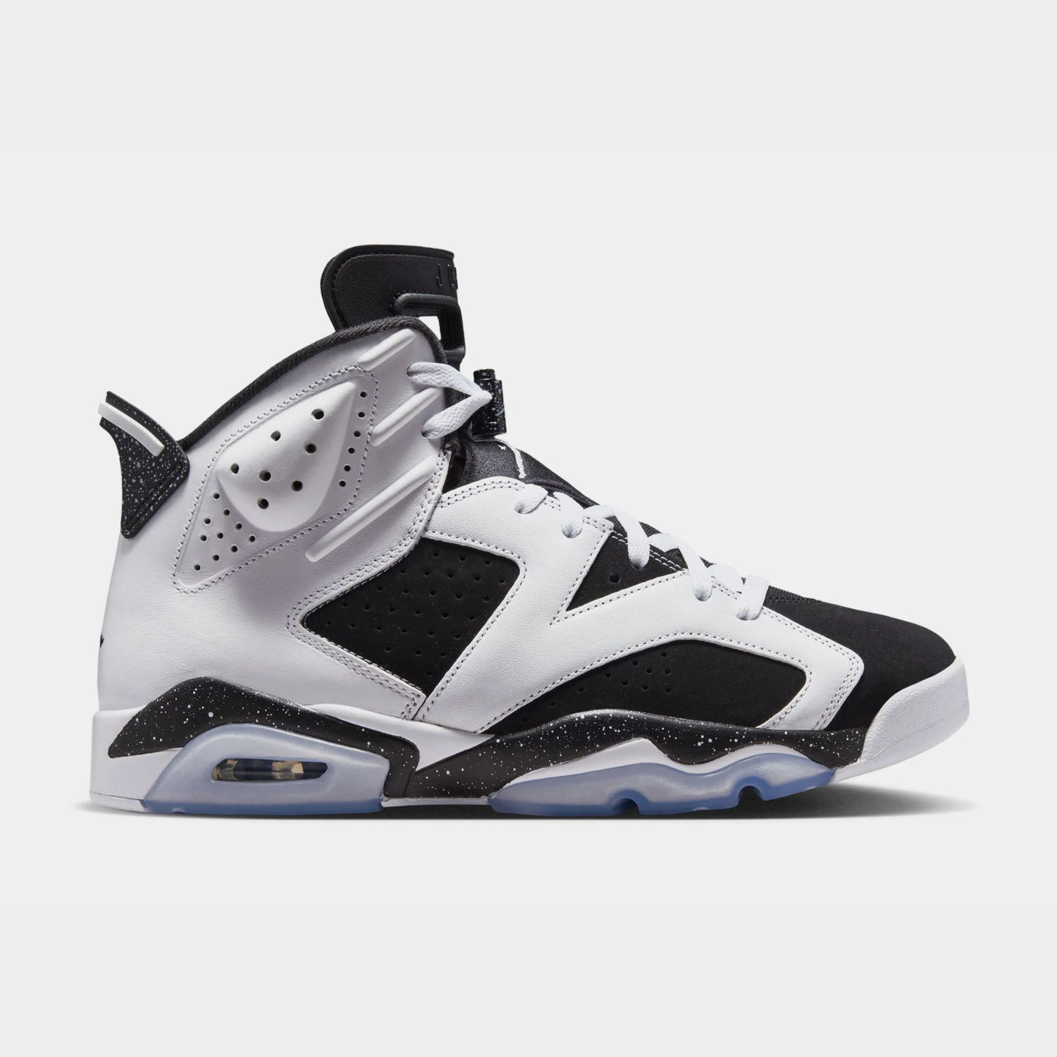 Black and white sneaker with icy sole, side view.