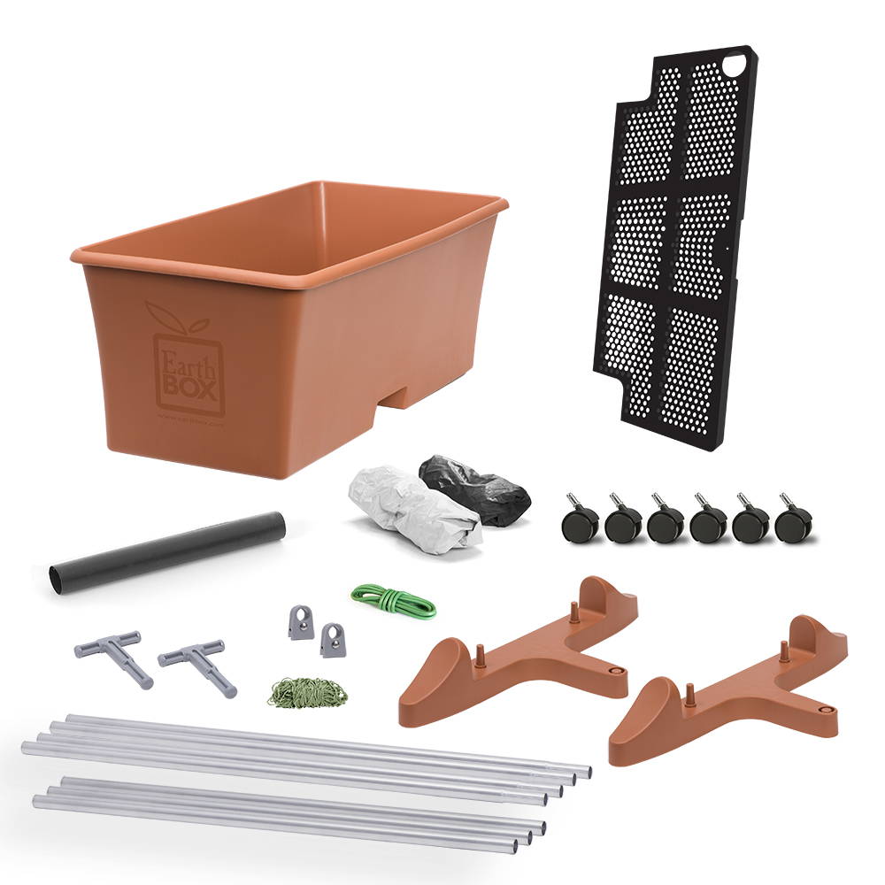 An terra EarthBox Tomato Container Gardening System Bundle which includes the container, aeration screen, water fill tube, 2 mulch covers, 6 caster wheels, a 7 foot staking system, and 5 feet of soft wire twist tie.