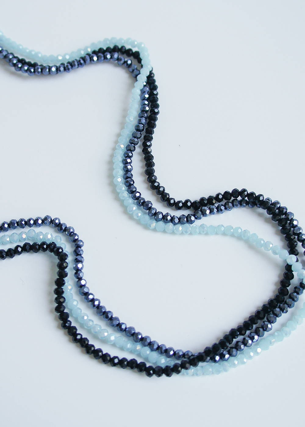 A selection of blue small beaded crystal necklaces