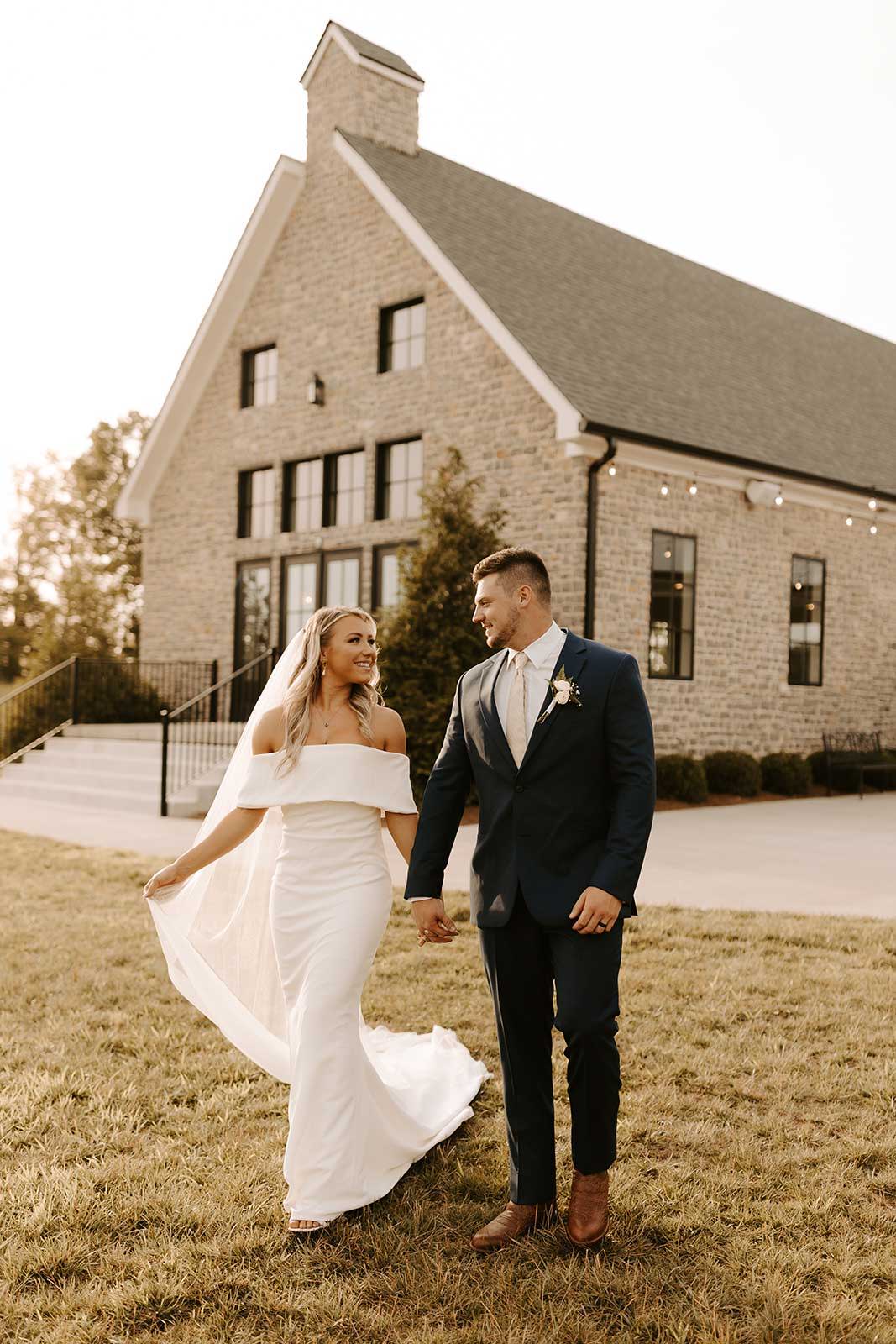 Bride and groom holding hands