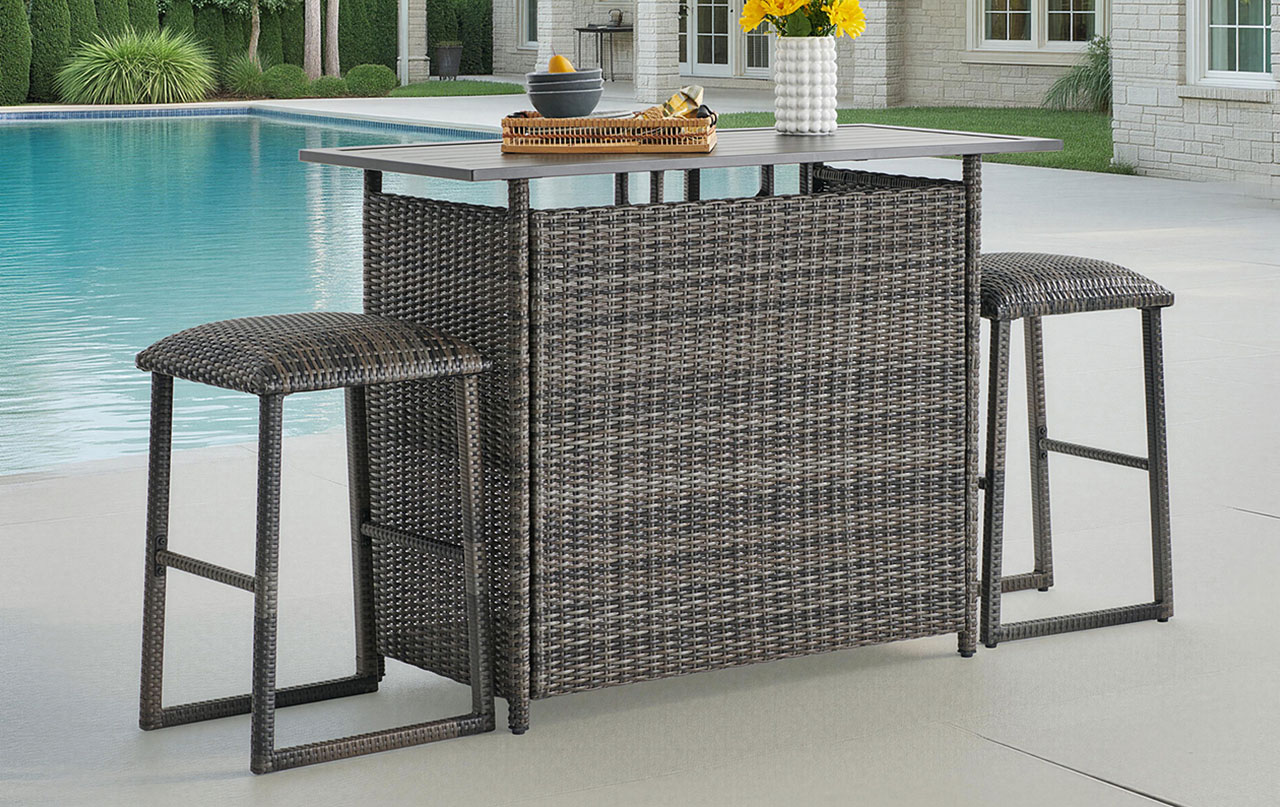 Outdoor bar set with stools by a swimming pool.