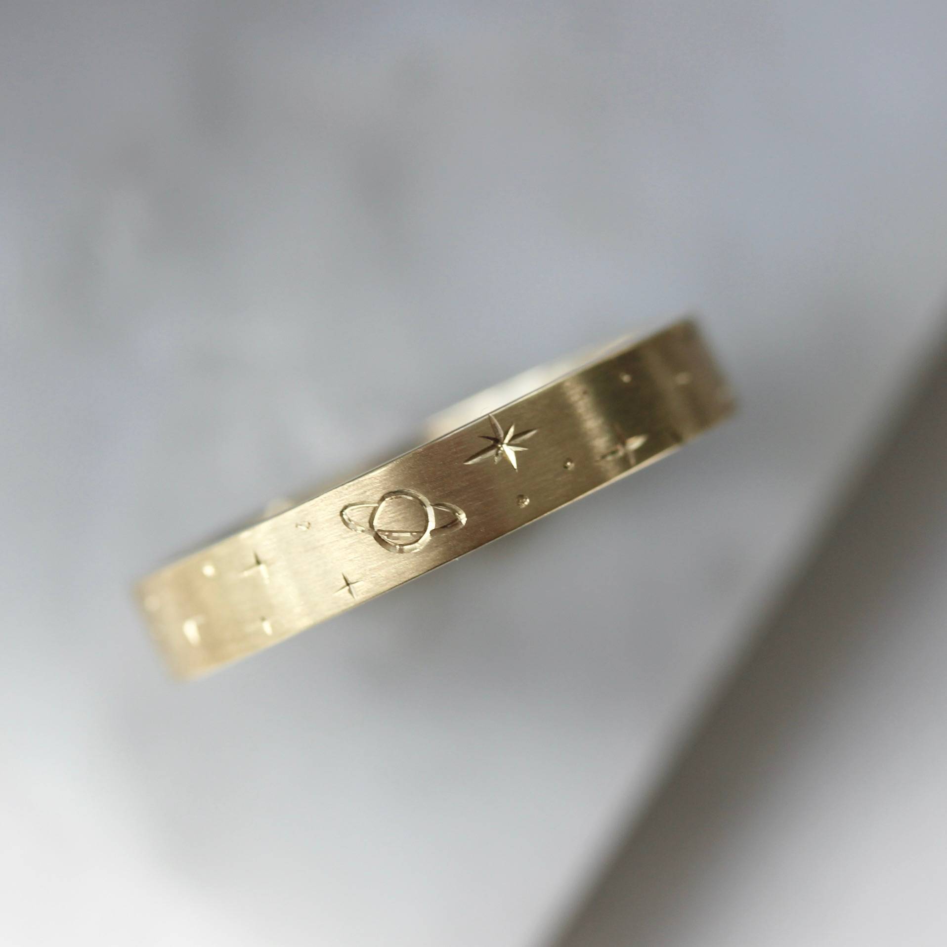 Stargazer engraved gold band