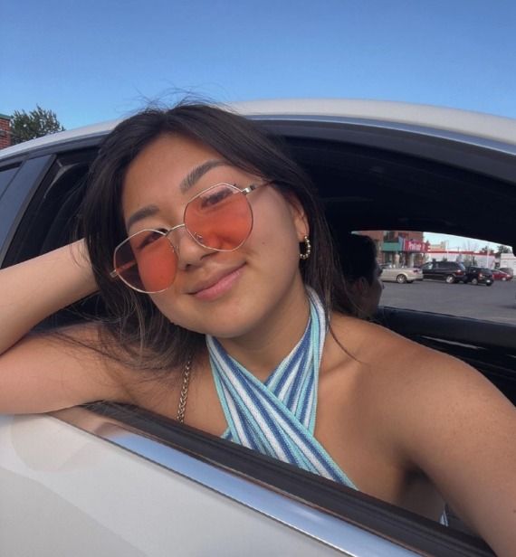 Asian woman wearing Elton, Elton John Sunglasses in Pink Hexagon