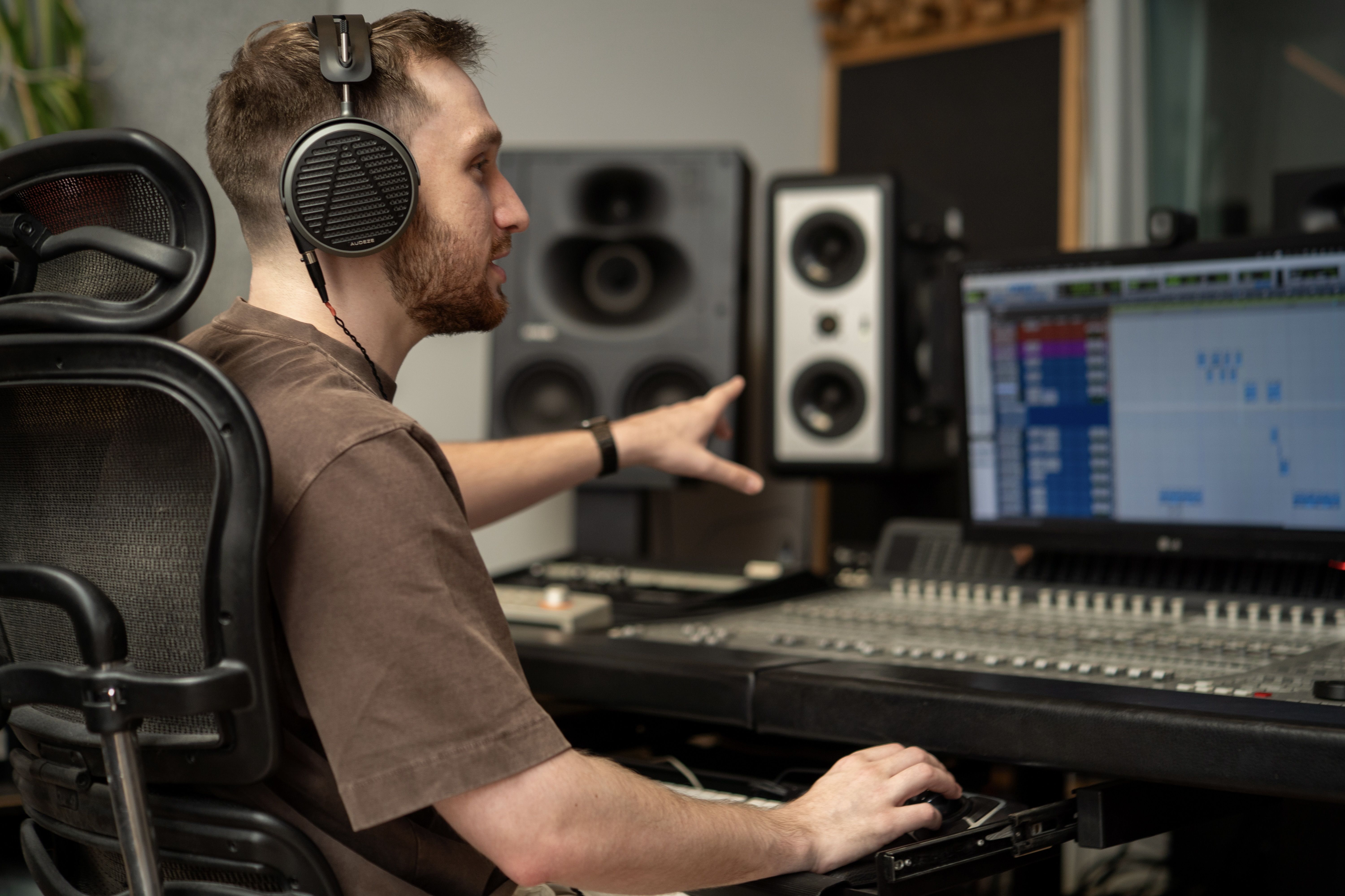 Ryan Kelly wearing Audeze MM-500 headphones mixing in the studio 