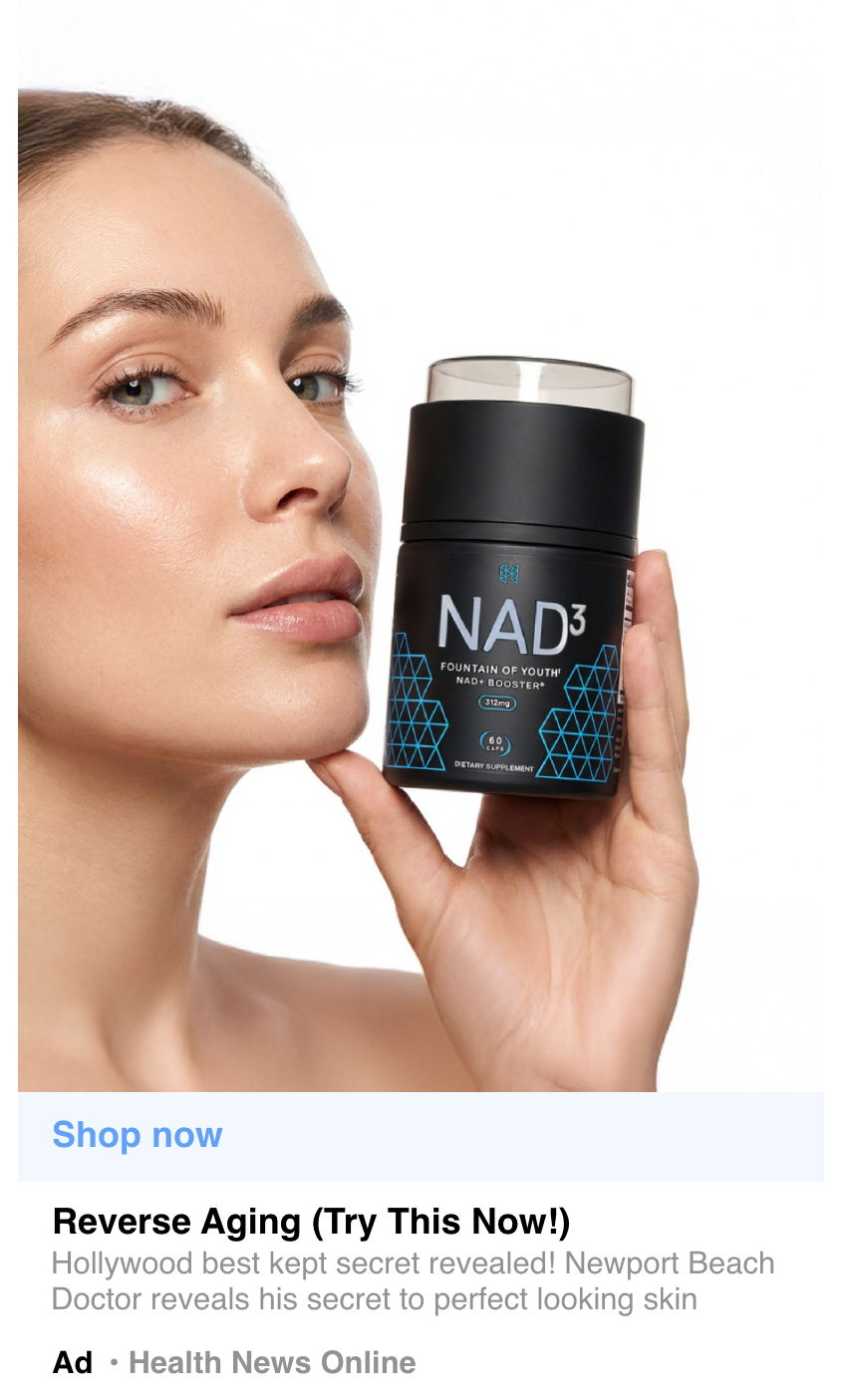 A woman holding a skincare product labeled 