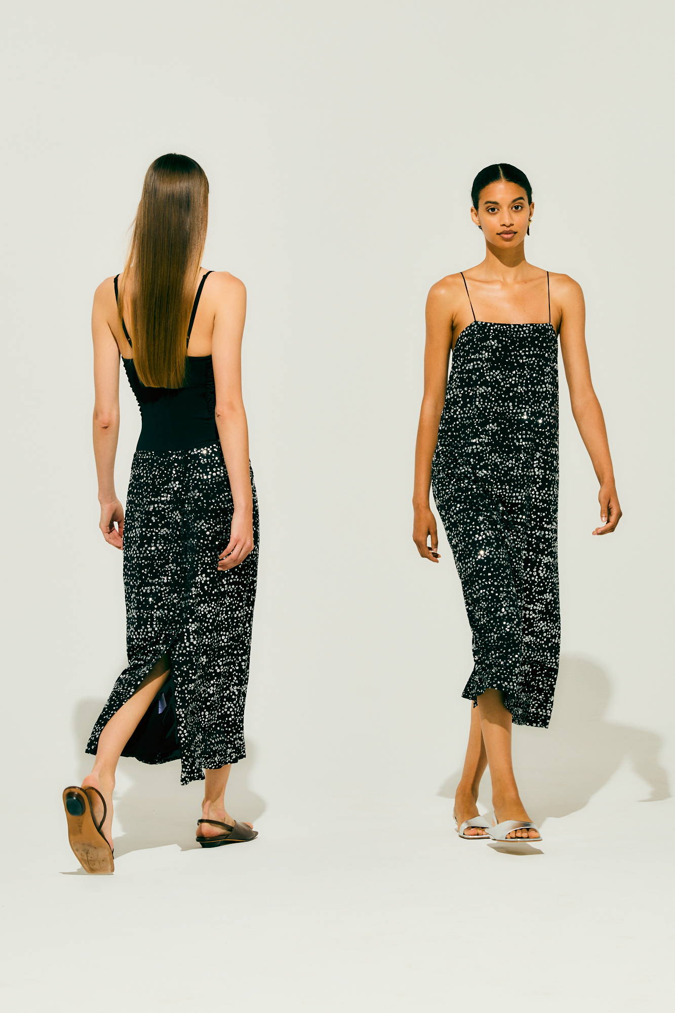 Two models wearing stylish dresses, one from the front and one from behind.