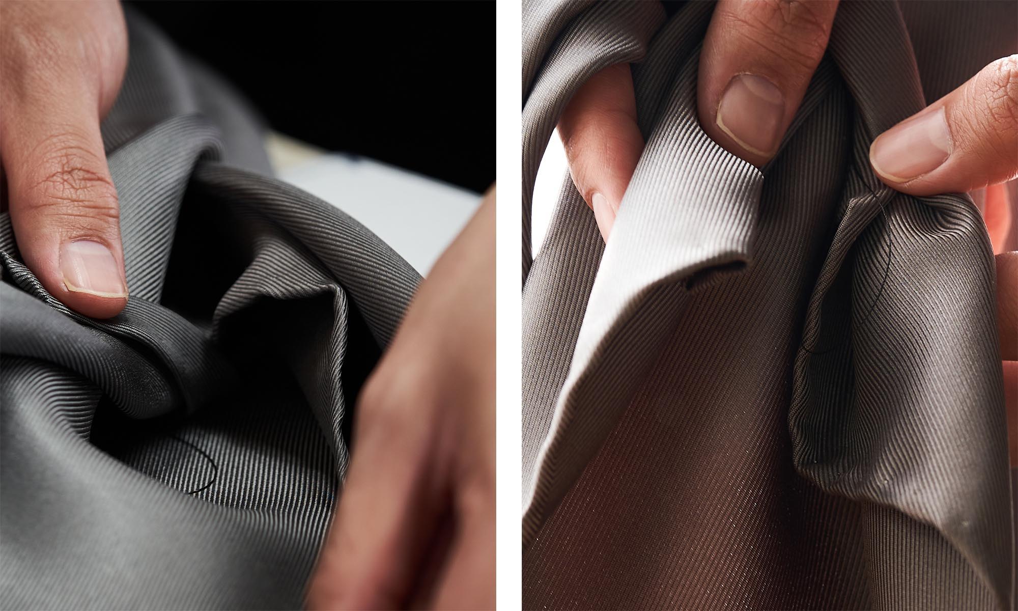 Close-up of hands manipulating soft, folded fabric.