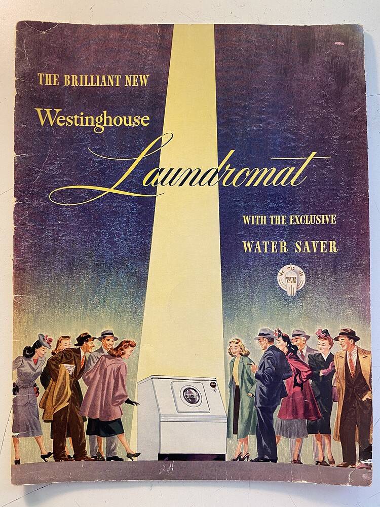 The cover of a Westinghouse Laundromat washing machine brochure. It features a laundry washing machine in the center with a spotlight shining on it while several Caucasian men and women  in suits and dresses marvel at it.