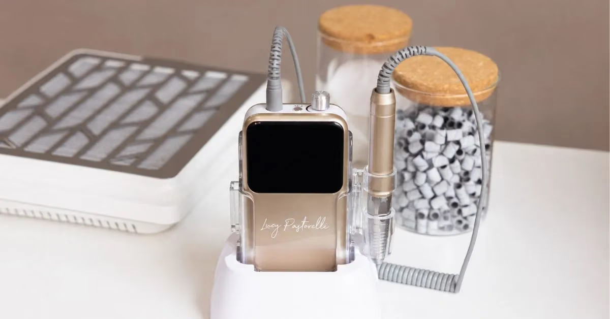 Smartwatch on charging dock next to decorative jars and a keyboard.