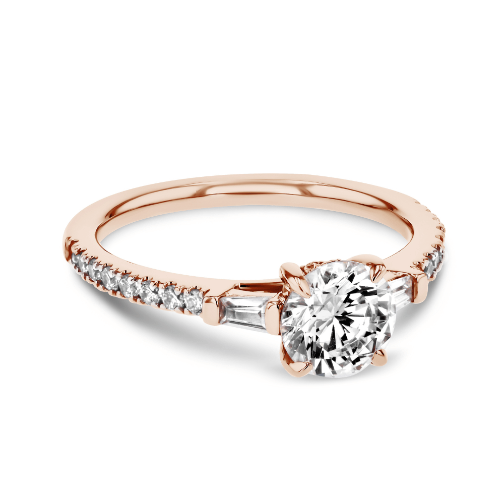 Unique diamond accented engagement ring with two baguette shoulder stones and a round cut diamond center