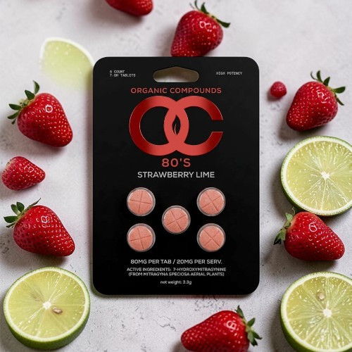 Strawberry lime gummies on a black packaging with fresh strawberries and lime slices.