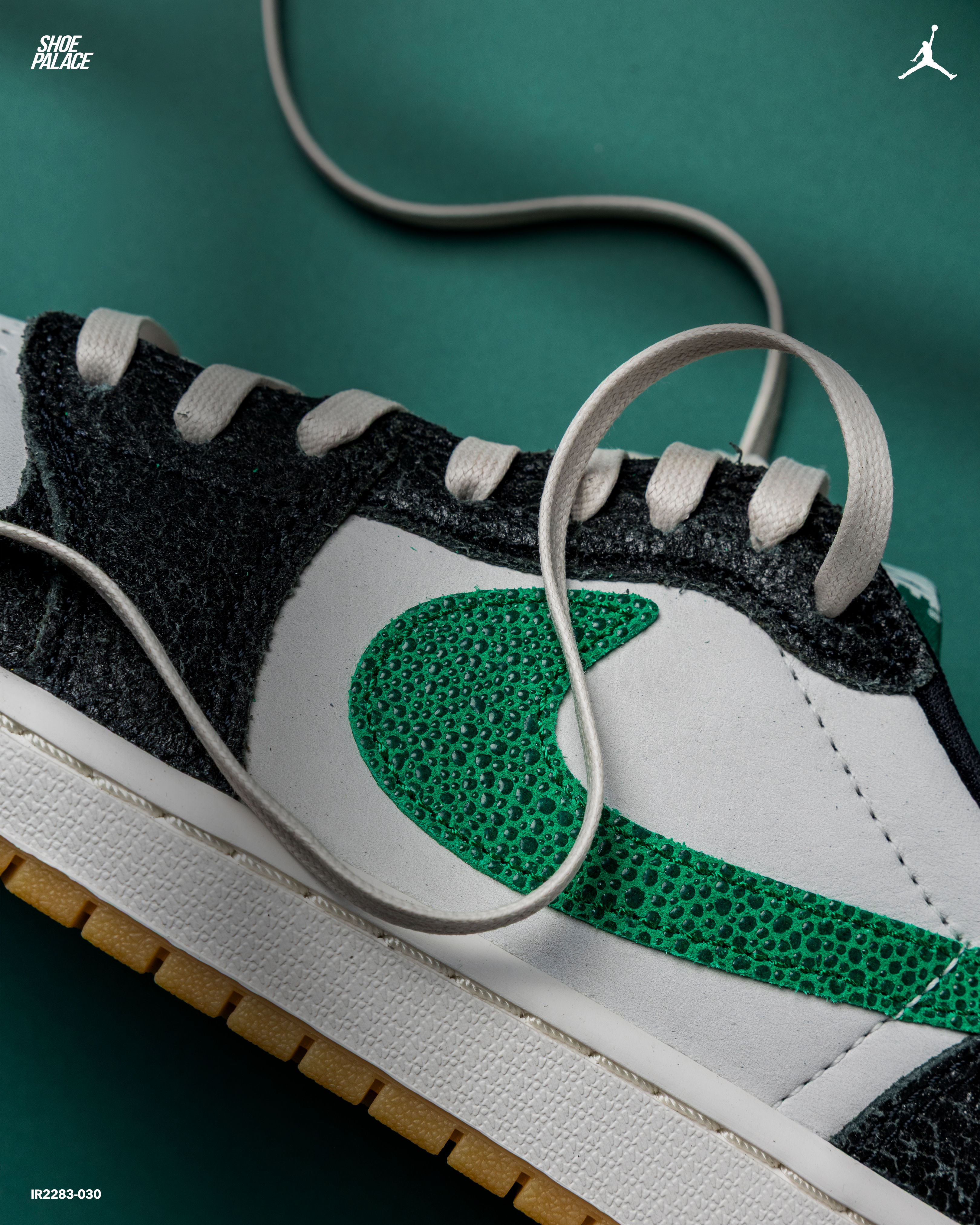 Close-up of a sneaker with a green Nike logo and laces.