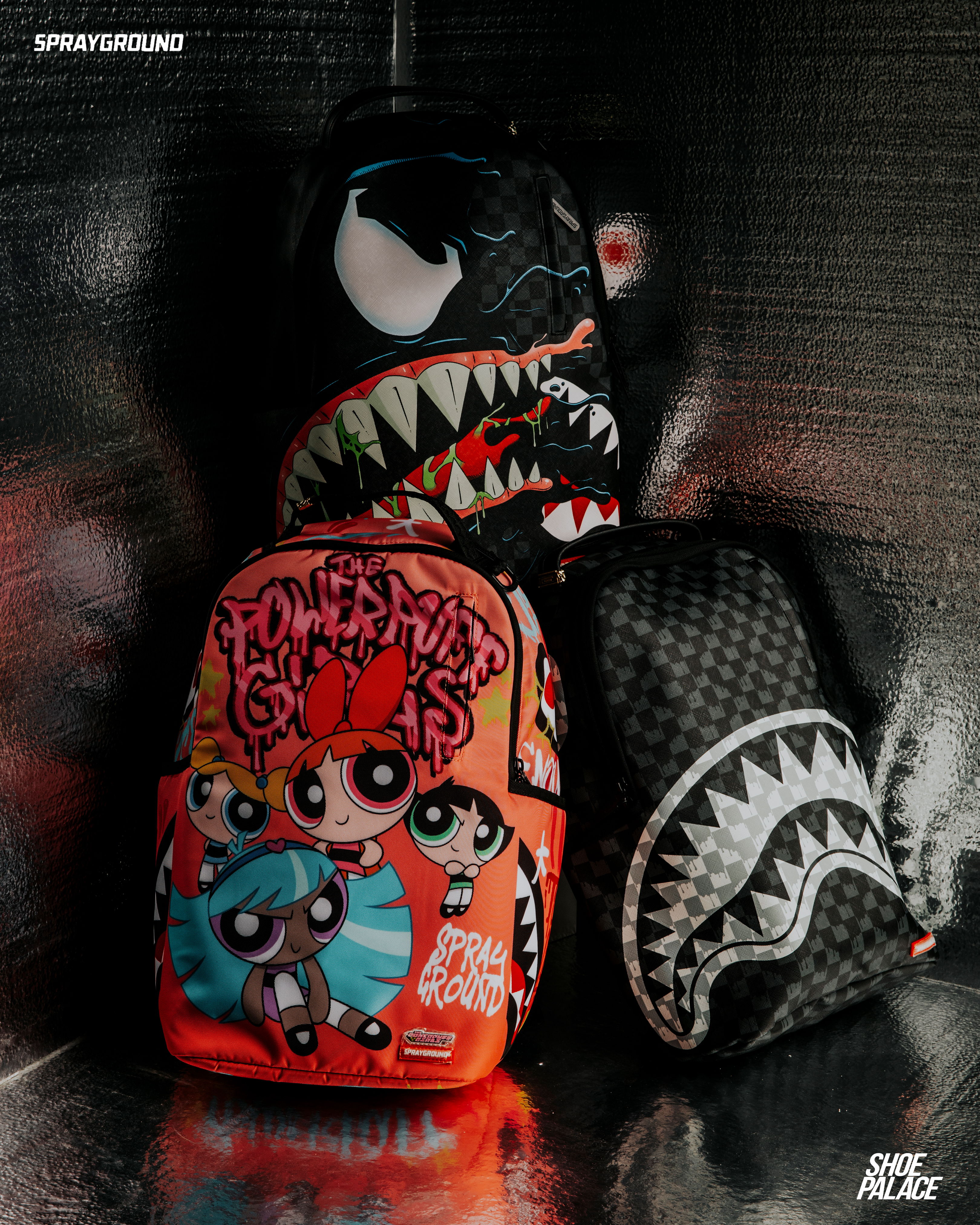 Colorful backpacks featuring cartoon characters and bold designs stacked together.