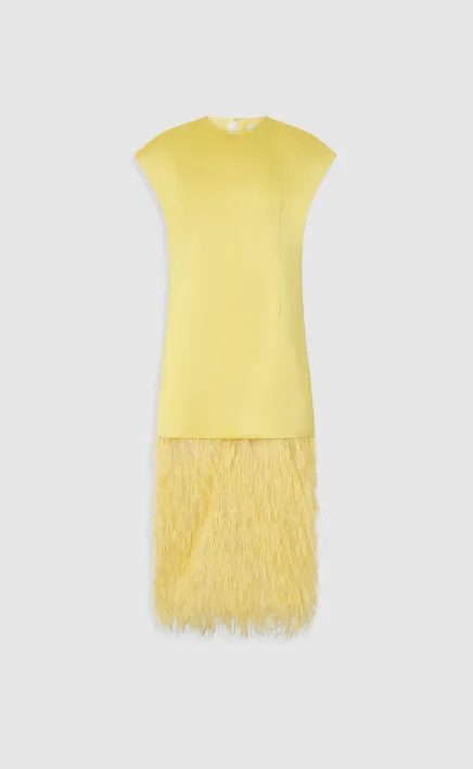 Yellow dress with a textured fringe hem.