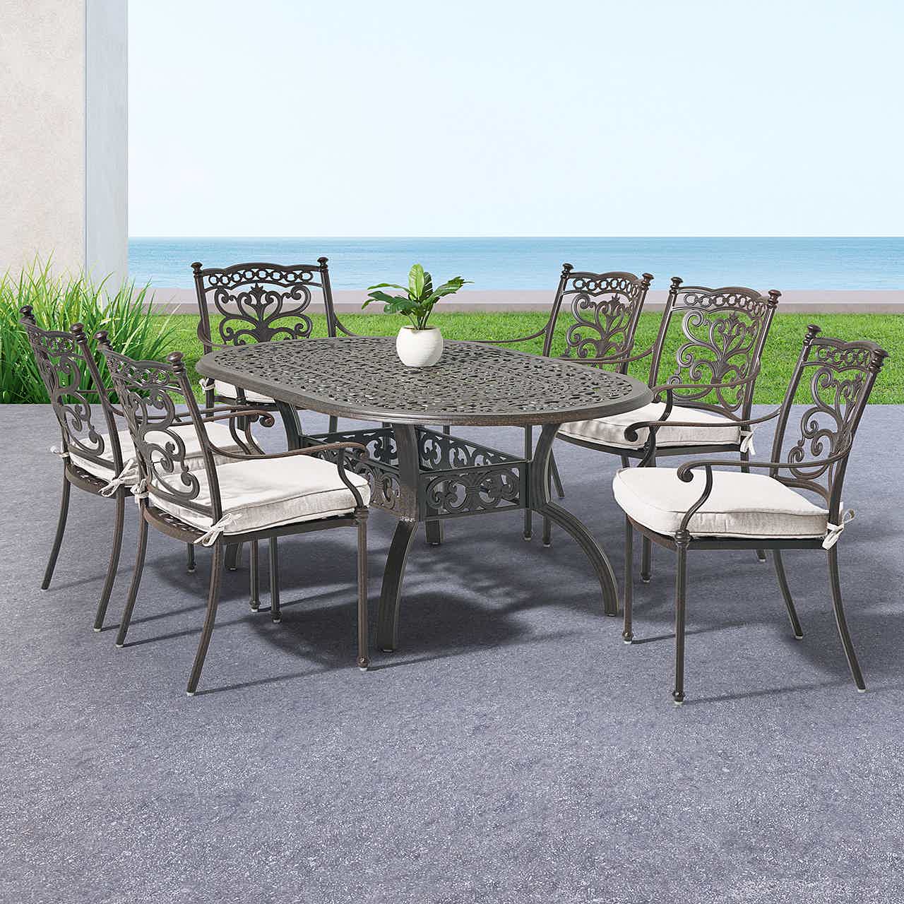 Outdoor dining set with six chairs and a square table.