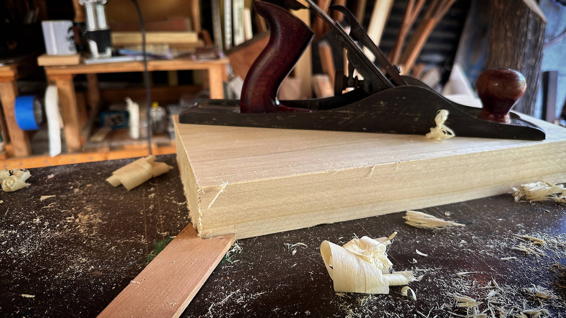 doe's foot on board with hand plane