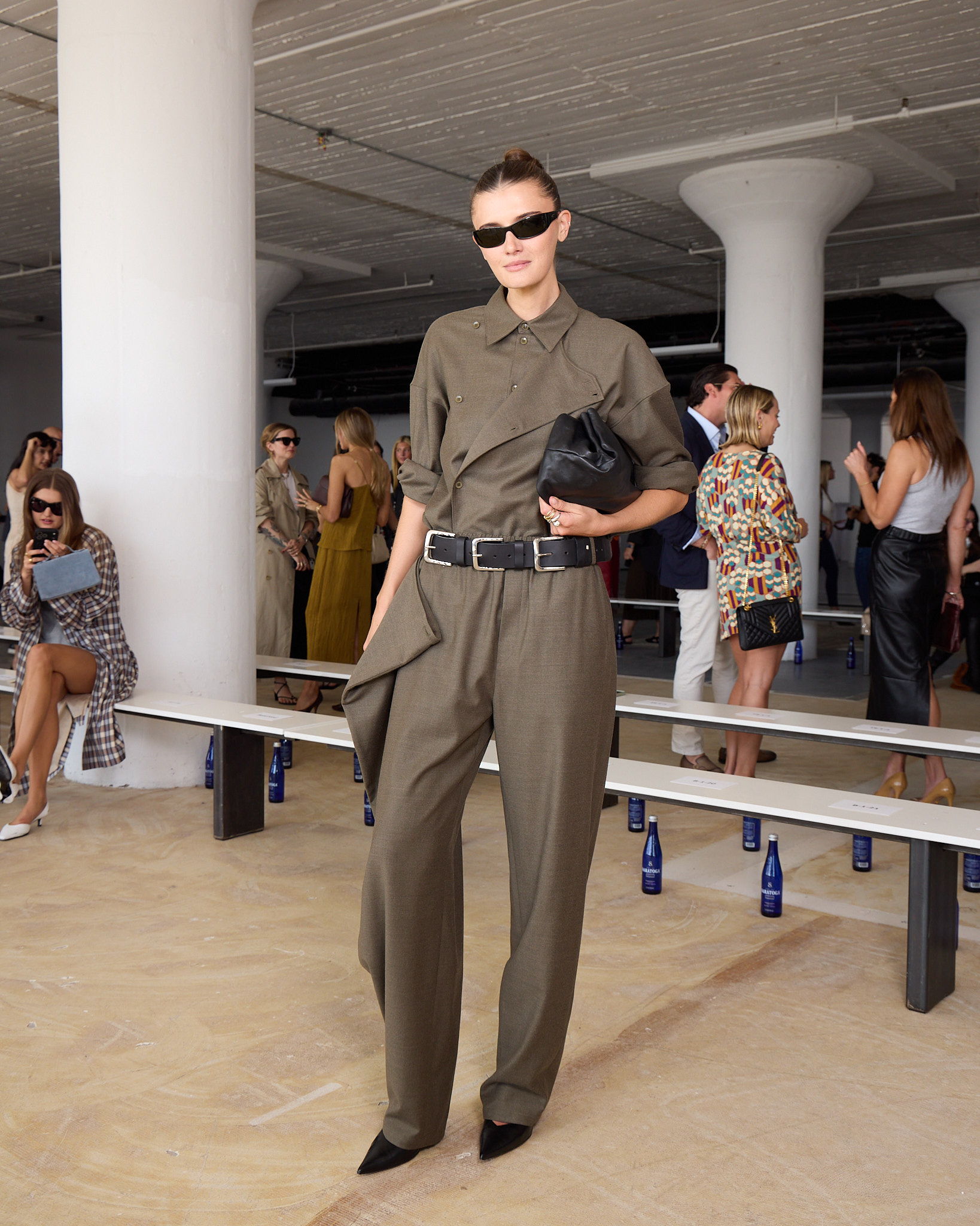 Coco Shchiffer at Tibi New York Fashion Week runway show wearing stylish outfit with sunglasses.
