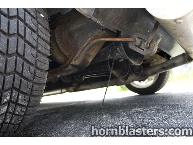Close-up hardware shot showing brackets airlines and fasteners on Chad's MINI Cooper horn install photo 9