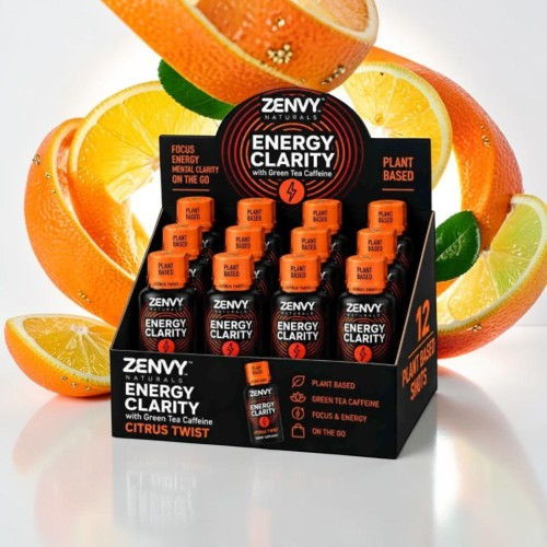 Display of Zenny Energy Clarity bottles with citrus fruits in the background.