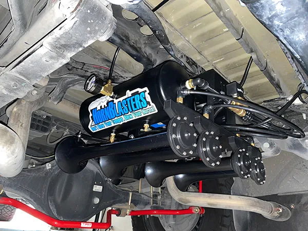 Side profile four train horns VIAIR compressor tiered bracket air lines red TRD sway bar rear differential Rudy's 2018 Tundra 244K gallery photo 2