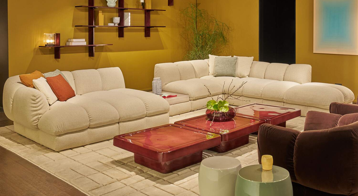 Stylish yellow and blue sofas with unique coffee tables.