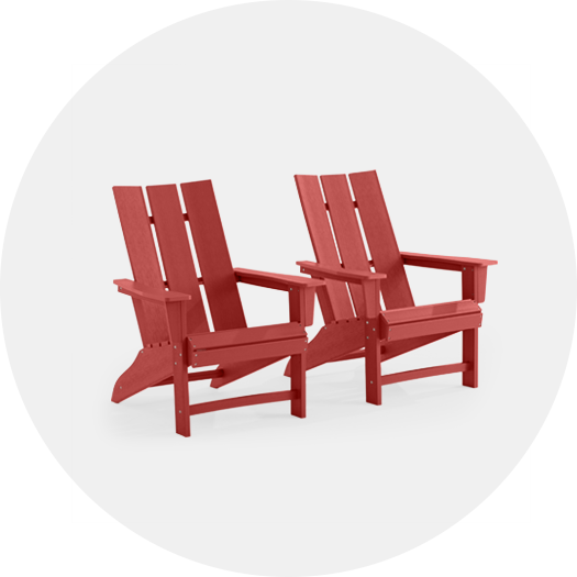 Two red Adirondack chairs on a white background.
