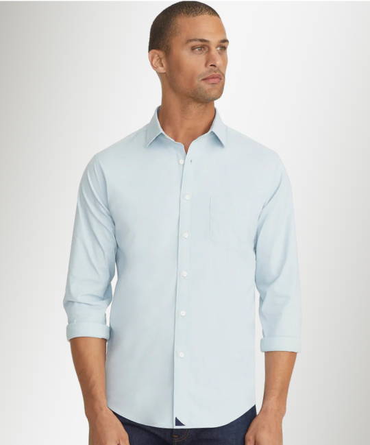 Model is wearing UNTUCKit Wrinkle-Free Performance Gironde Shirt in light blue.