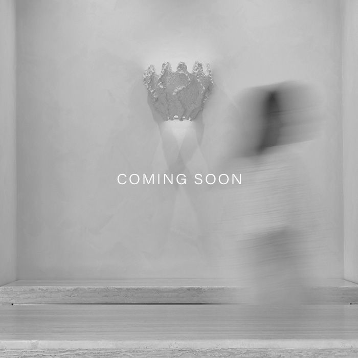 COMING SOON - Black and white image of store with shell light