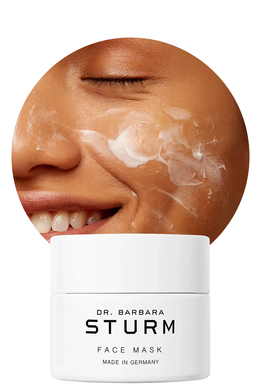 Smiling person applying face mask with product container below.