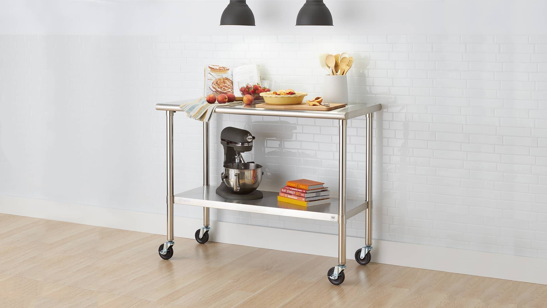 all stainless steel prep table with wheels in kitchen