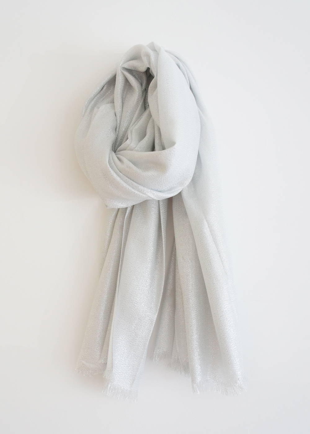A silver scarf with raw hem detailing