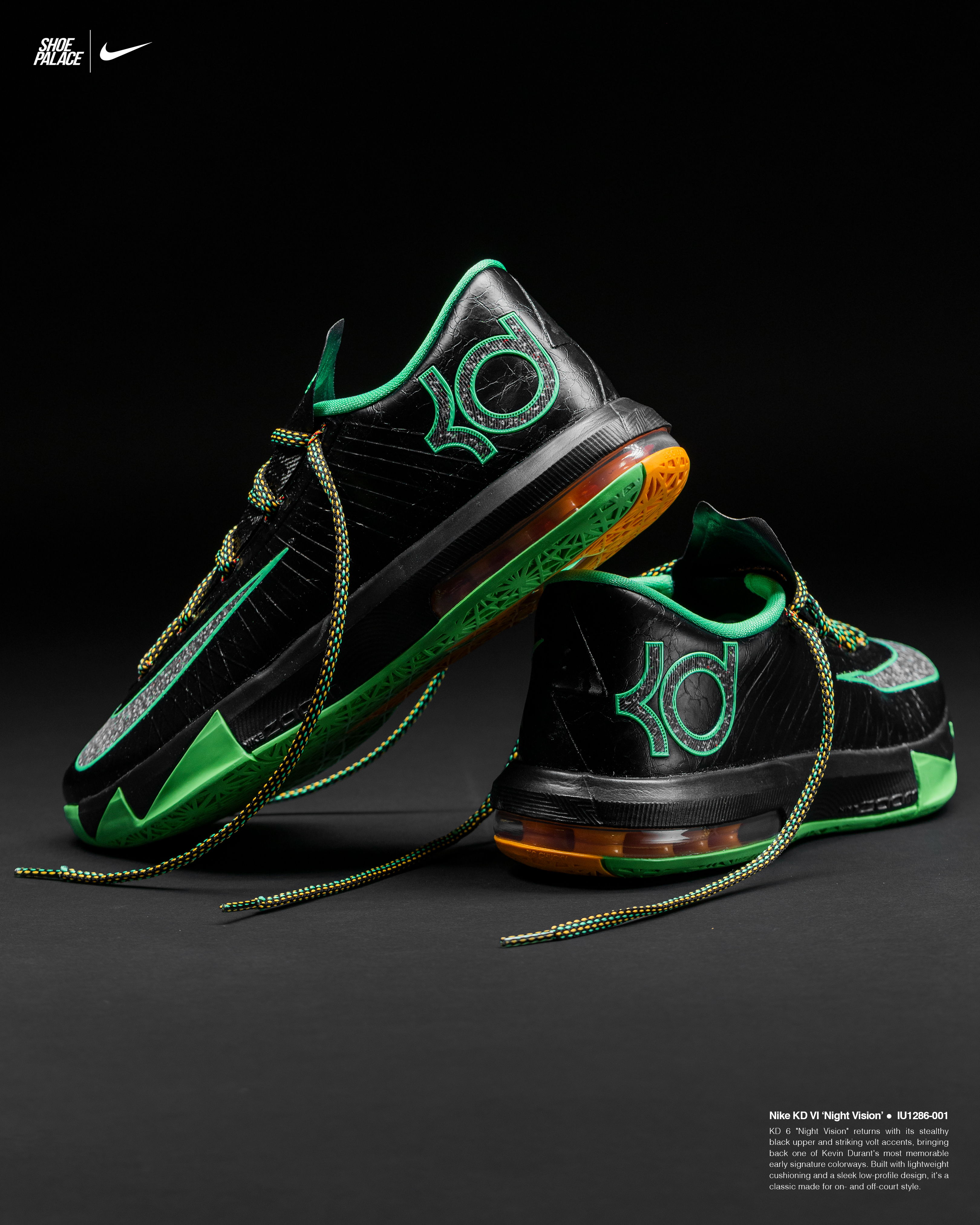 Black and green Nike sneakers with orange accents on a dark background.