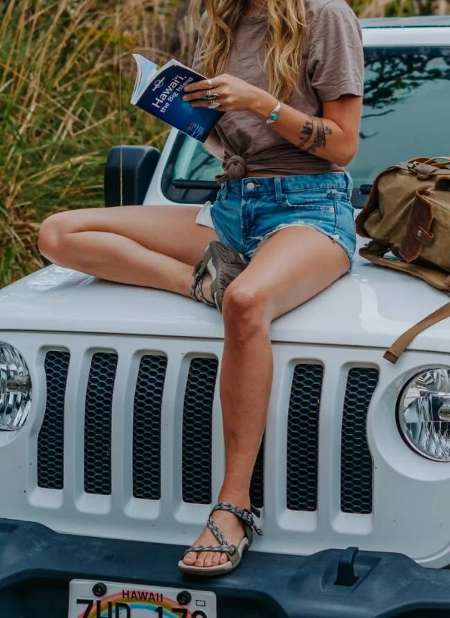 woman sitting on car with cute sandals