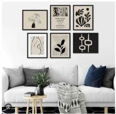 Living room with framed art on the wall and a cozy sofa.