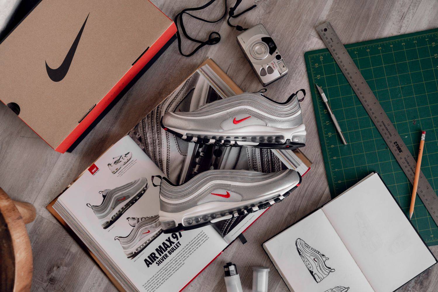 nike air max 97 silver bullet on top of shoe box