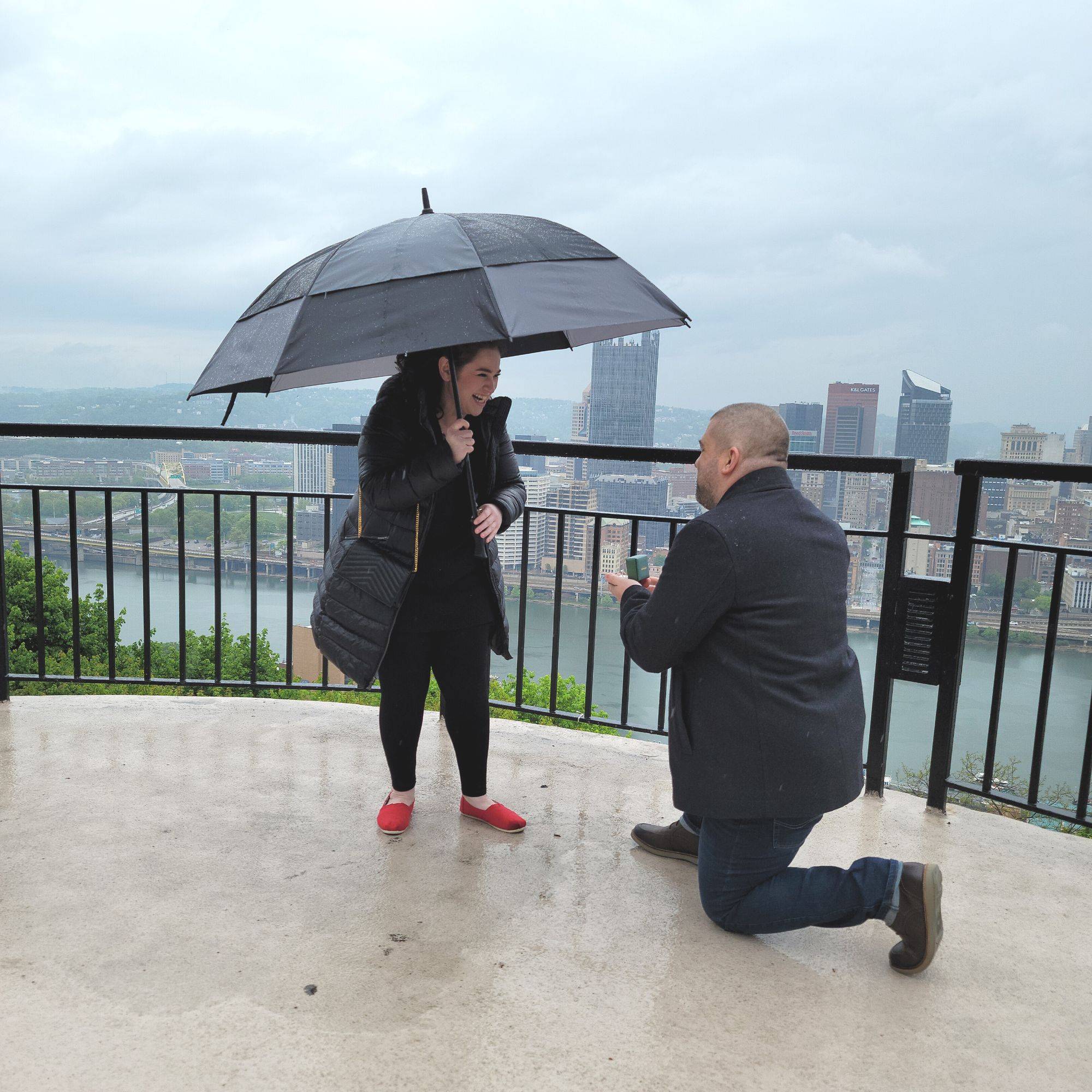 Joe kneeling proposing to Elyssa