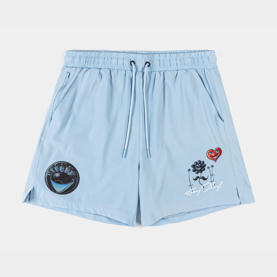 Light blue swim shorts with embroidered designs and pockets.