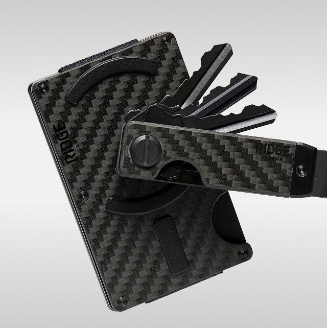 A carbon fiber wallet with attached key holder.