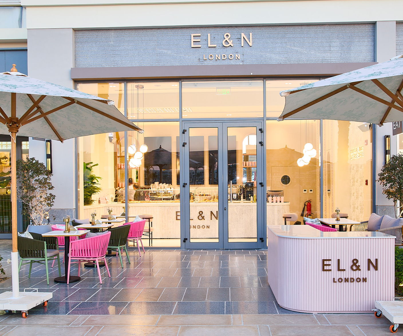 Exterior of EL&N café with outdoor seating and umbrellas.