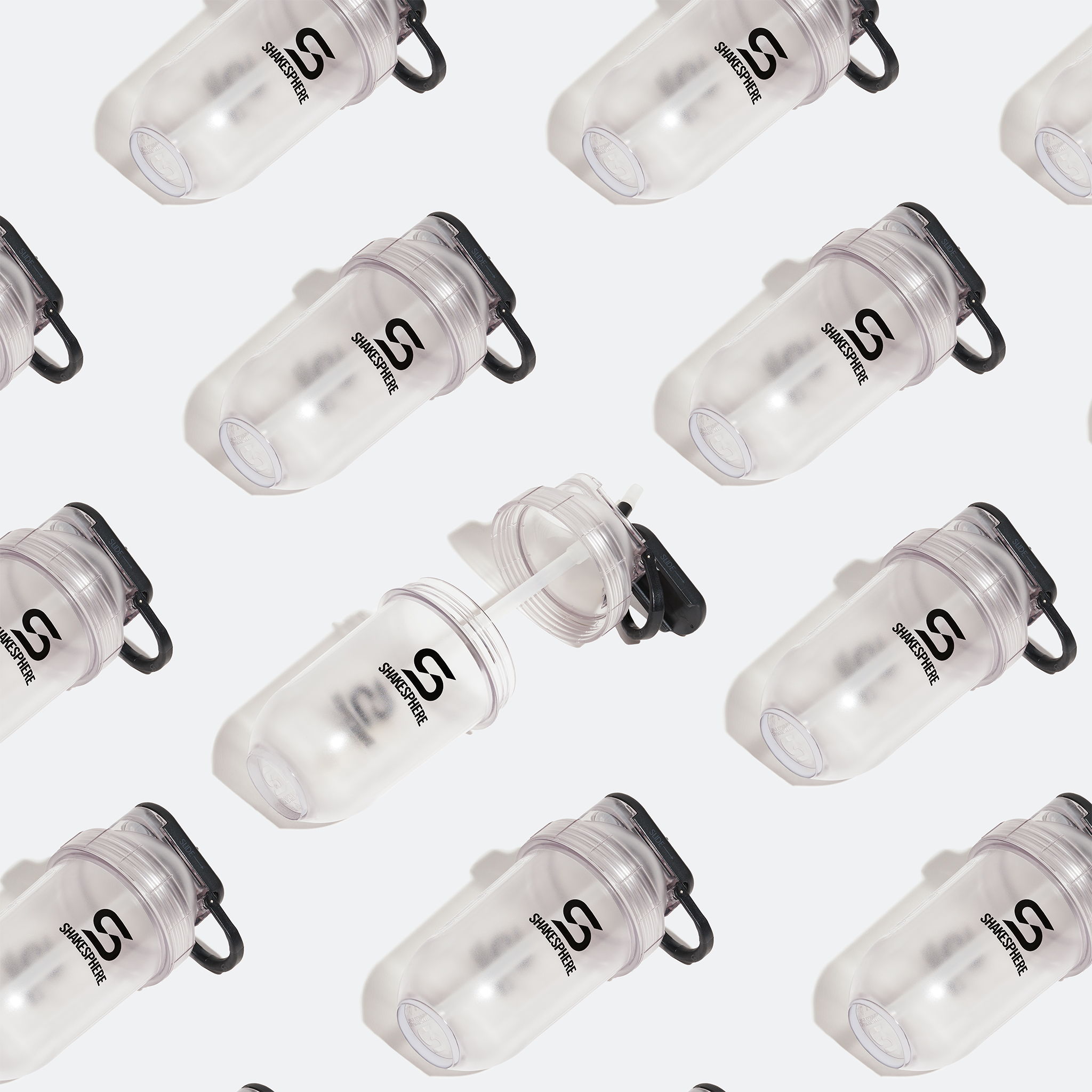 Pattern of transparent bottles with a black logo on a light background.