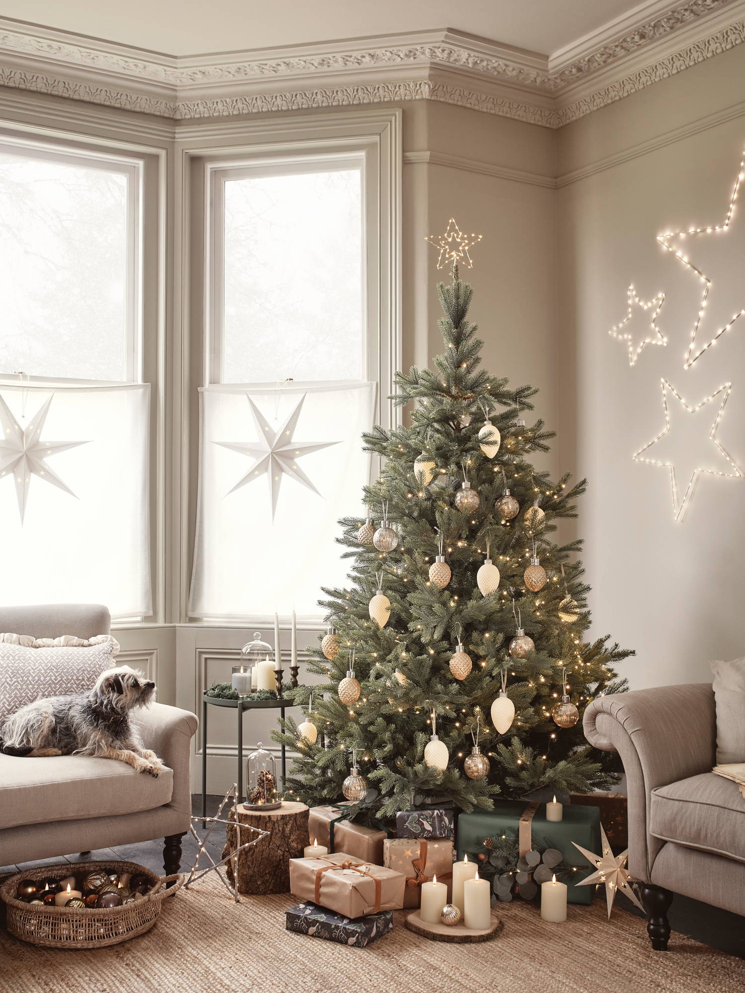 Christmas tree with gold baubles and warm colours.