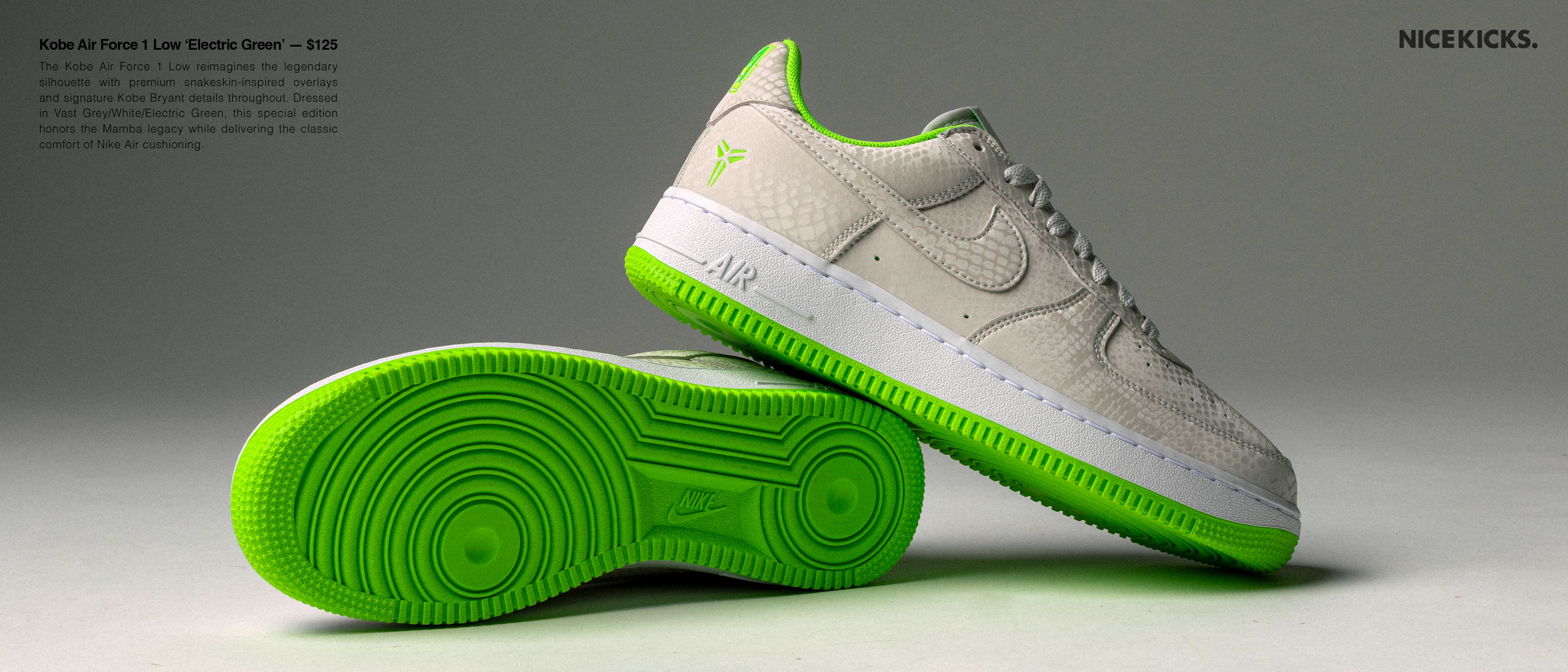 A pair of sneakers with a white upper and green sole.