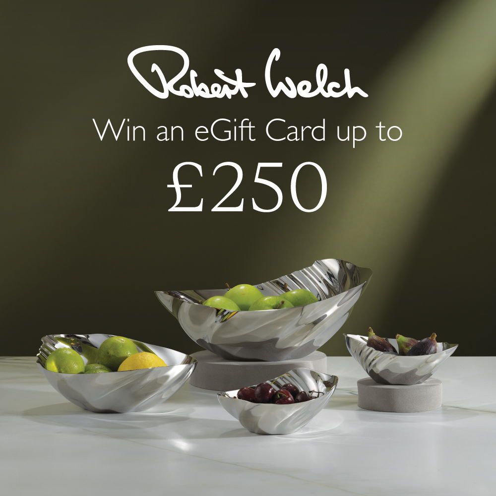 Display of bowls with fruits and a promotion for an eGift card.